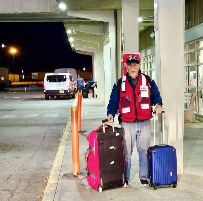 man and suitcases at an airport