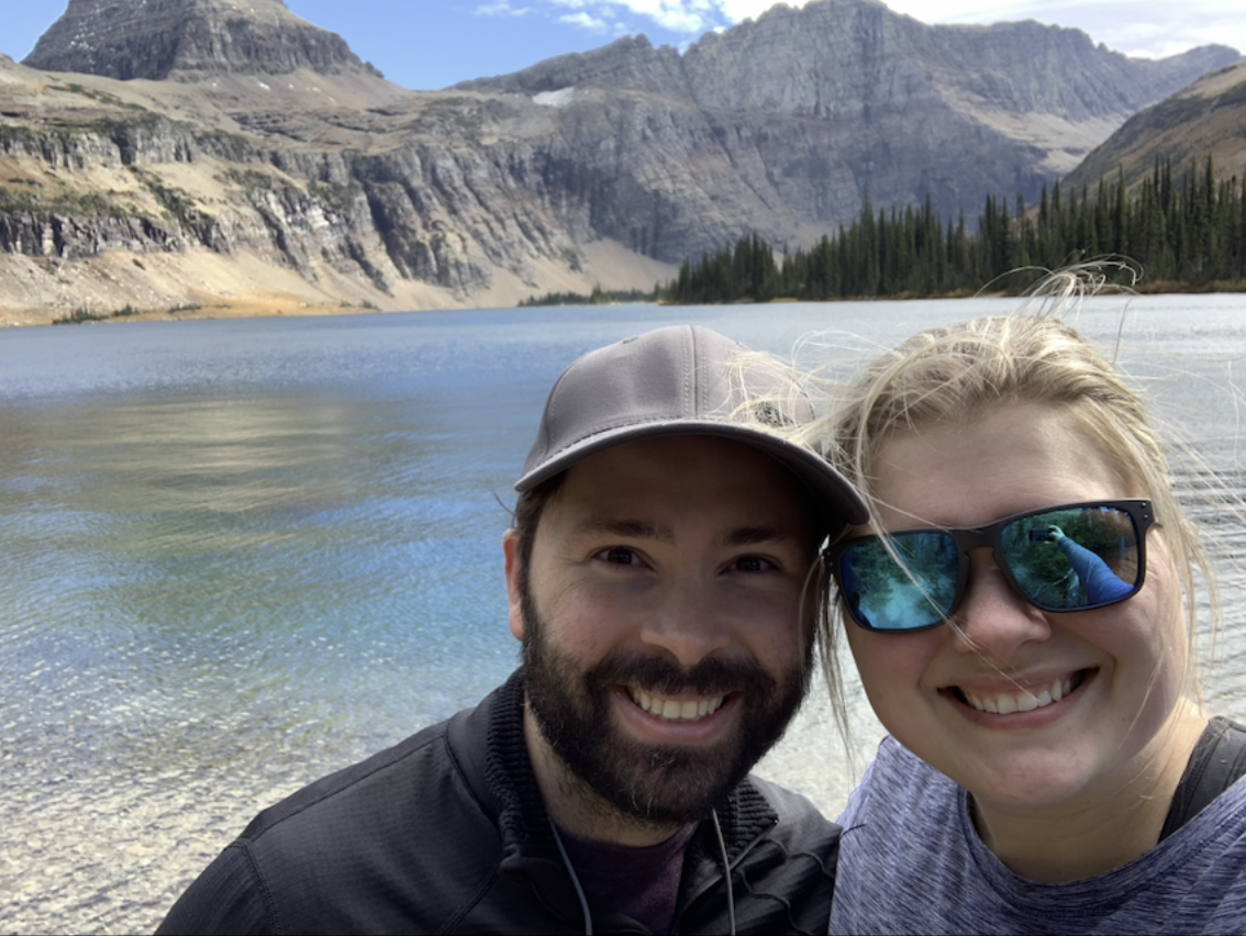 Man and woman in front of a lake