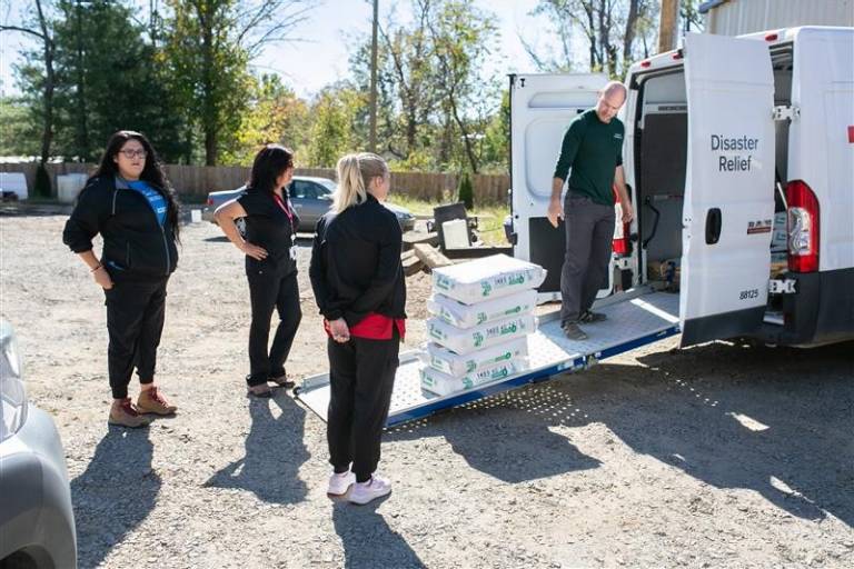 Photo of Red Cross workers loading disaster relief supplies.