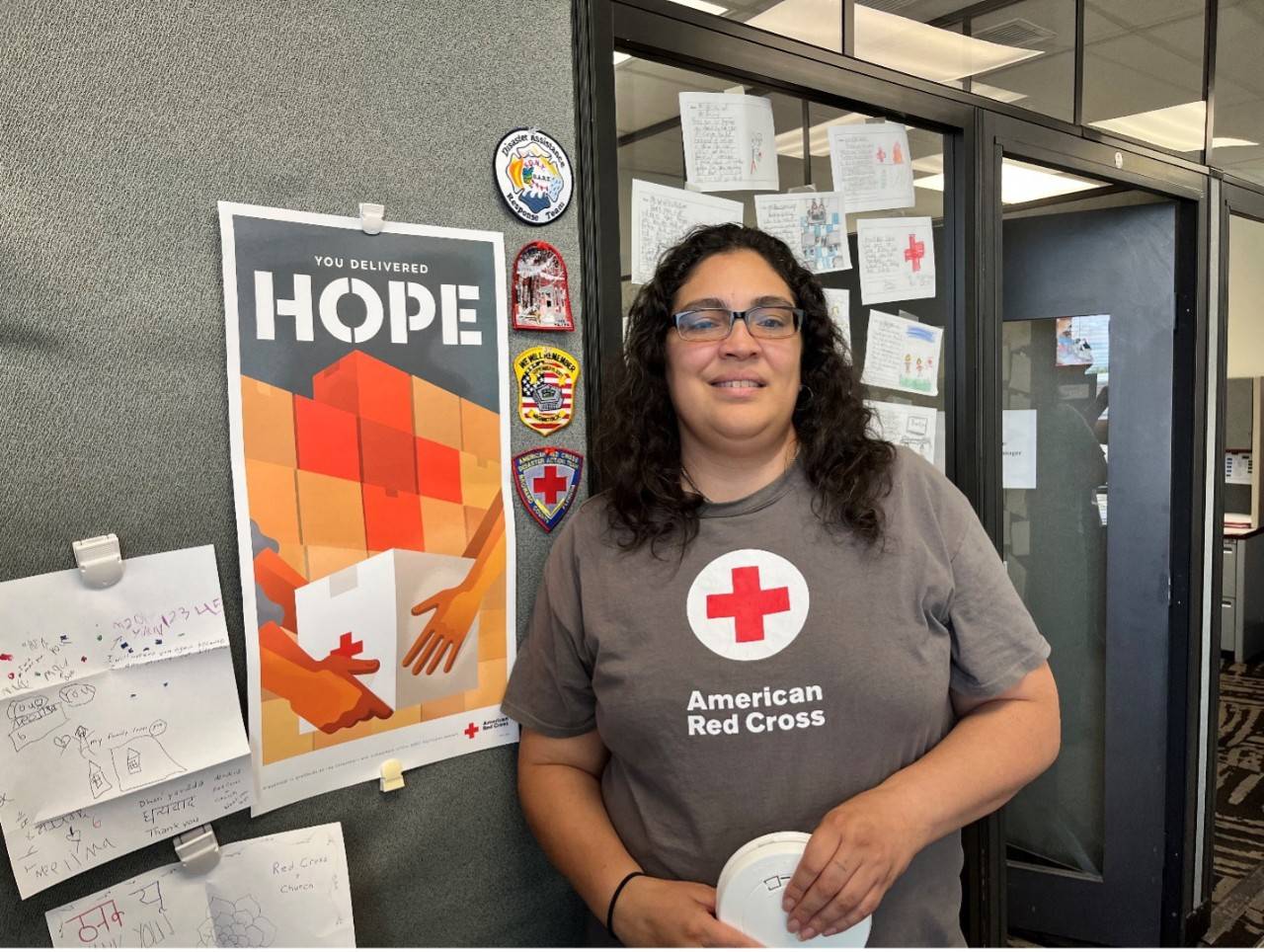 Woman in Red Cross shirt