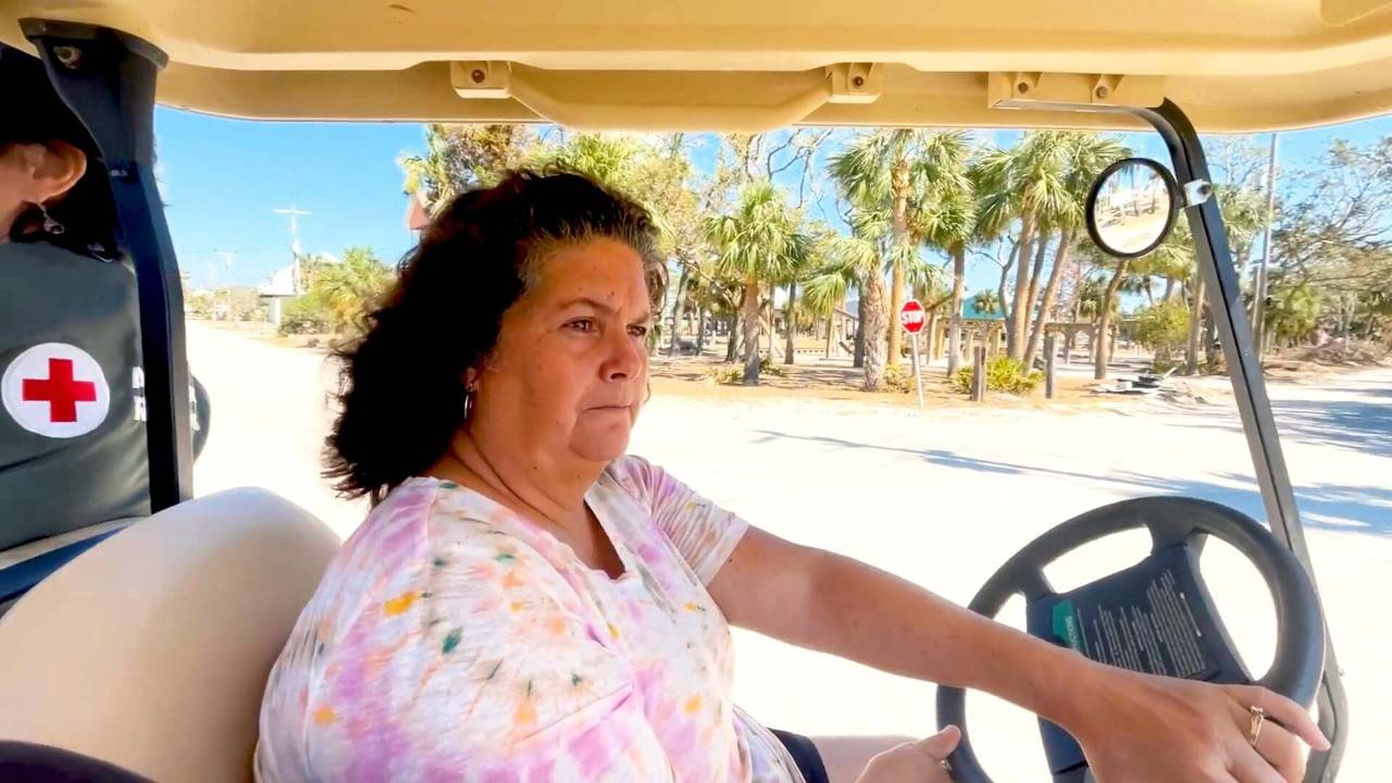 Woman in golf cart