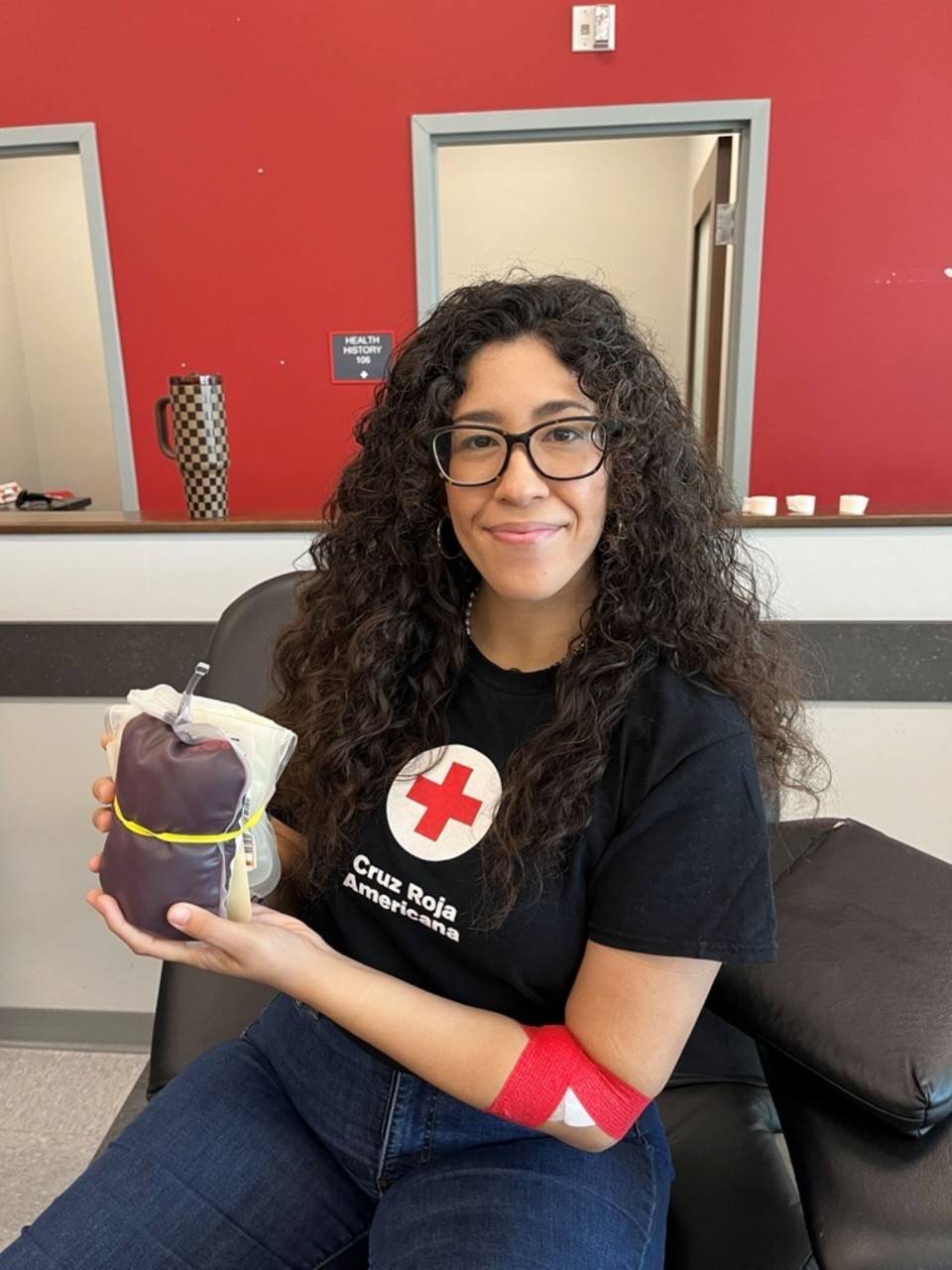 Person holding a bag of her donated blood