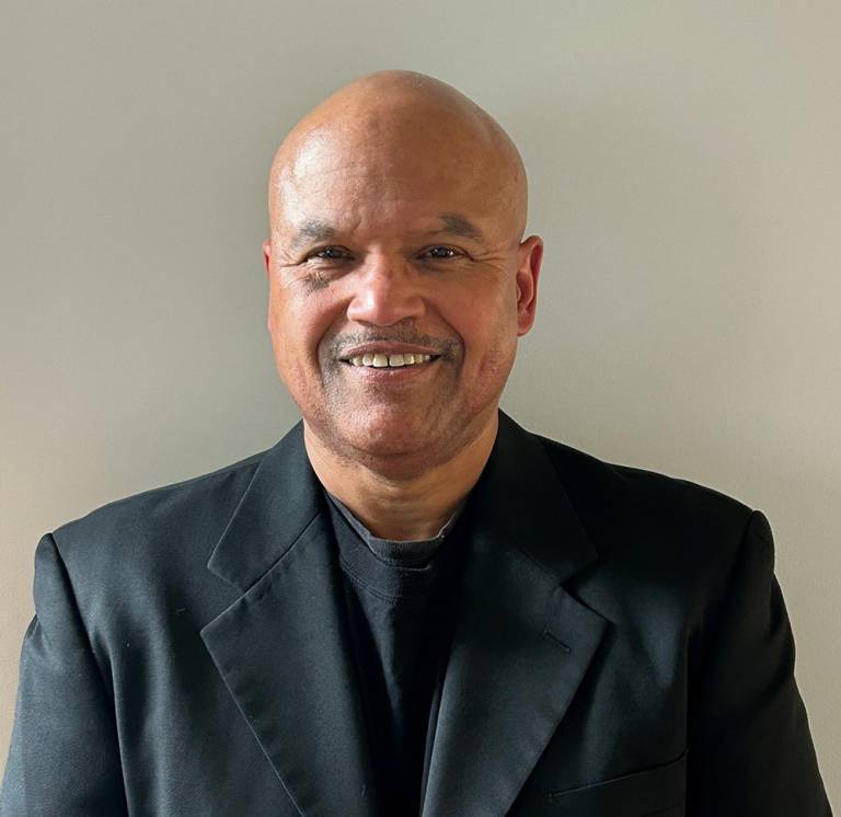 Headshot of Dr. David Mair, a Red Cross medical director, wearing a black blazer.