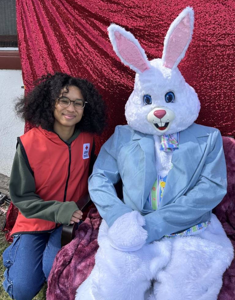 woman wearing Red Cross vest and Easter Bunny