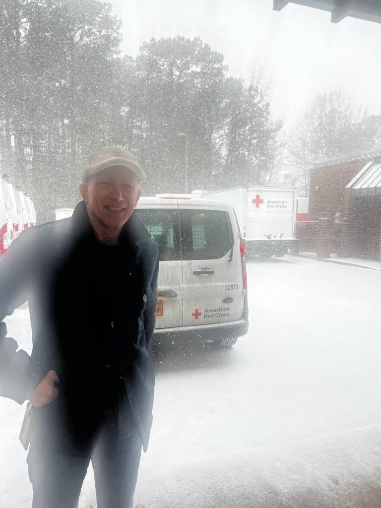 Man stands behind van