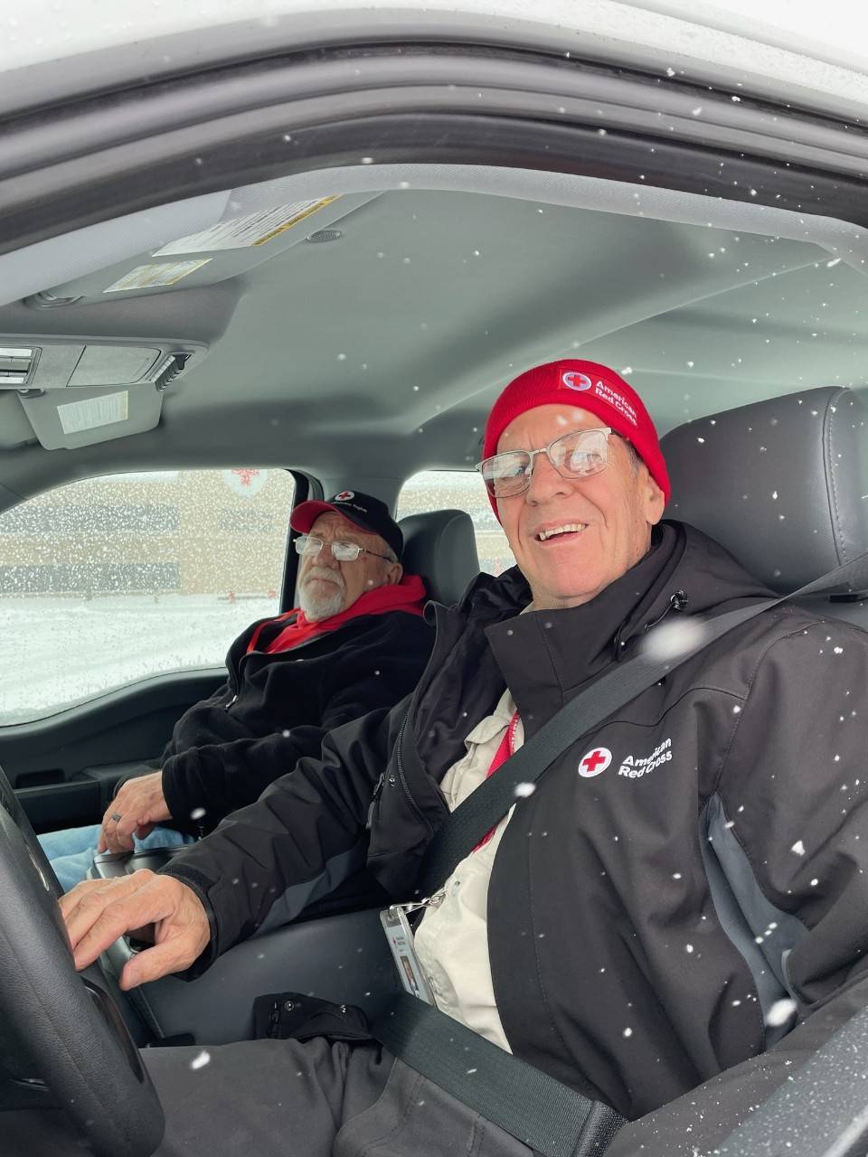 Two men in pick-up truck