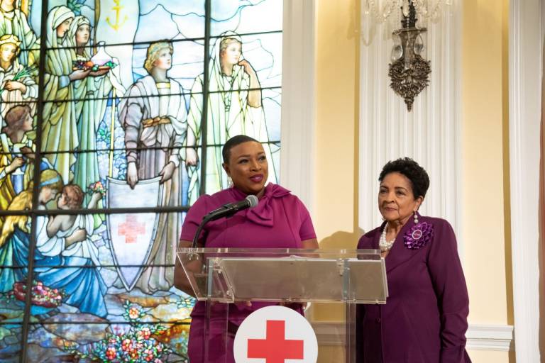 Two women behind a podium