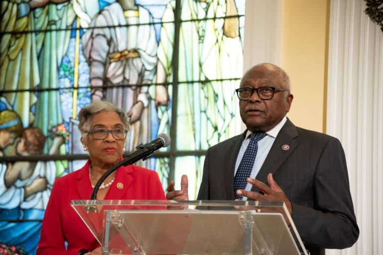 Man and woman at podium