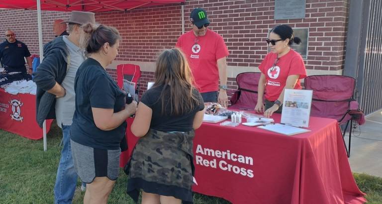 two Red Cross volunteers working together