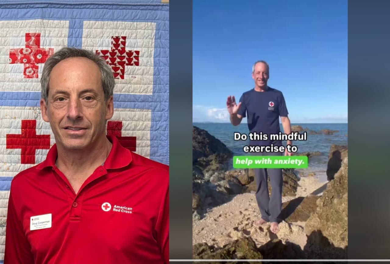 A headshot of Doug Cooperman. He wears a Red Cross-branded polo shirt and the background is a blue and white quilt with red crosses stitched in.  