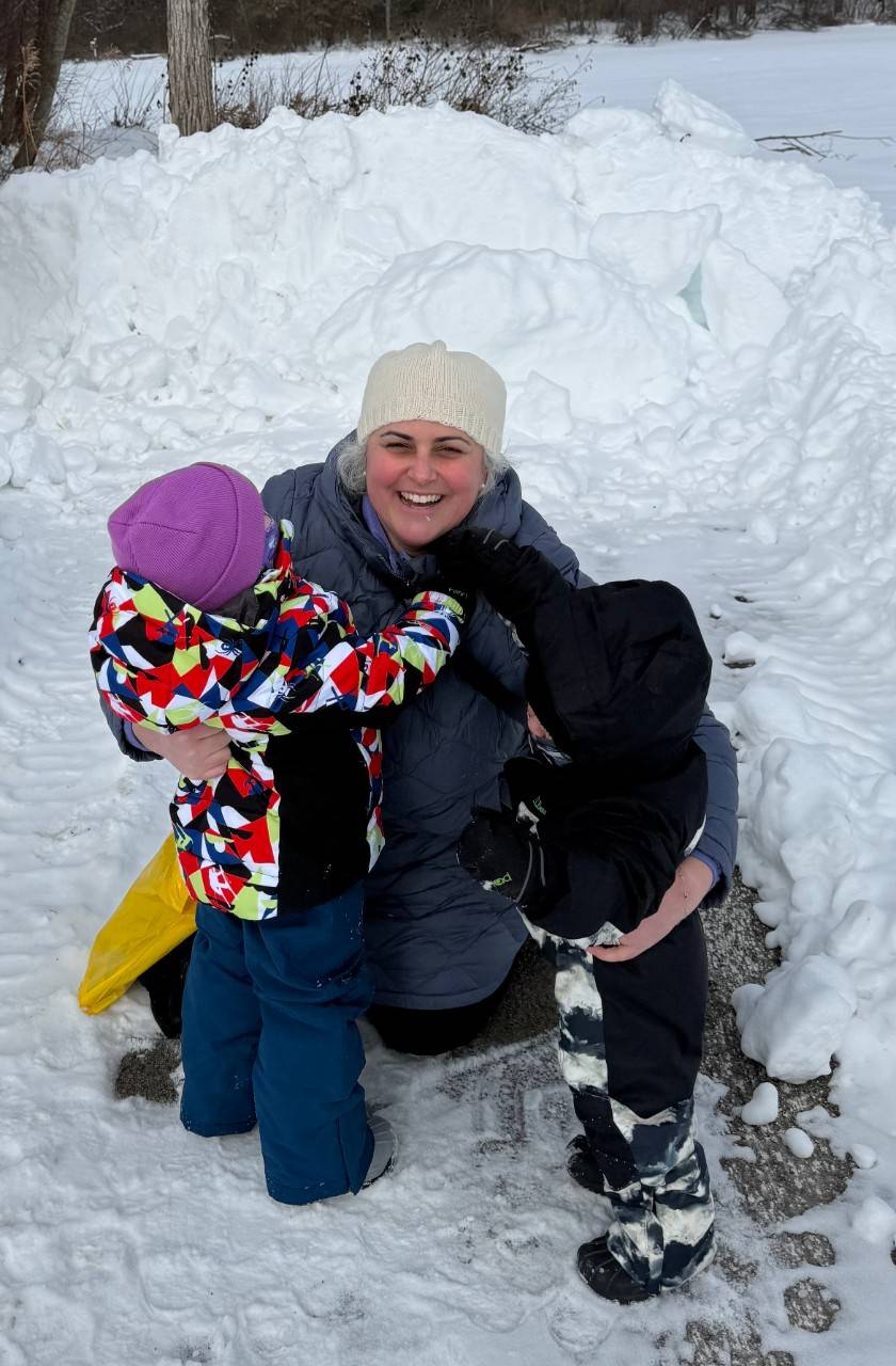 Dr. Hewett Brumberg plays in the snow with her children. As a mom and pediatrician, she says being prepared for emergencies is part of everyday caregiving.