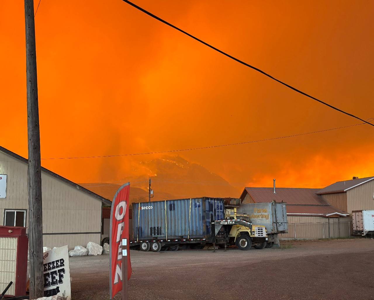 Skies are bright orange from glow of the wildfires.