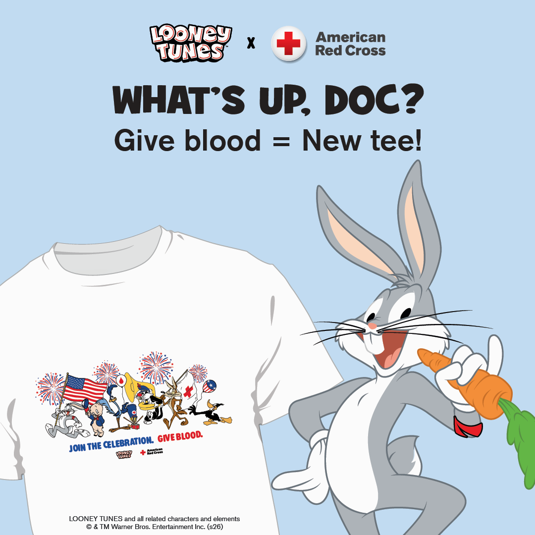Bugs Bunney stands next to a bright white T-shirt that features Looney Tunes characters and the words “Join the celebration. Give blood.”