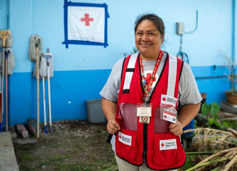 Woman in Red Cross vest