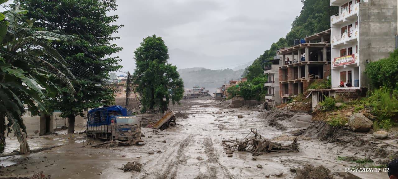 Brown mud can been seen where a community once stood along the banks of the Bhote 