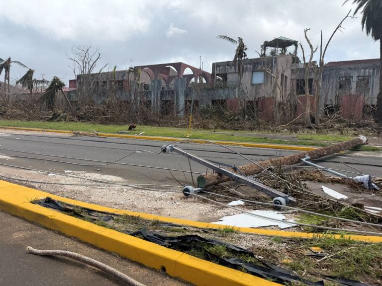 A building with its roof heavily damaged.