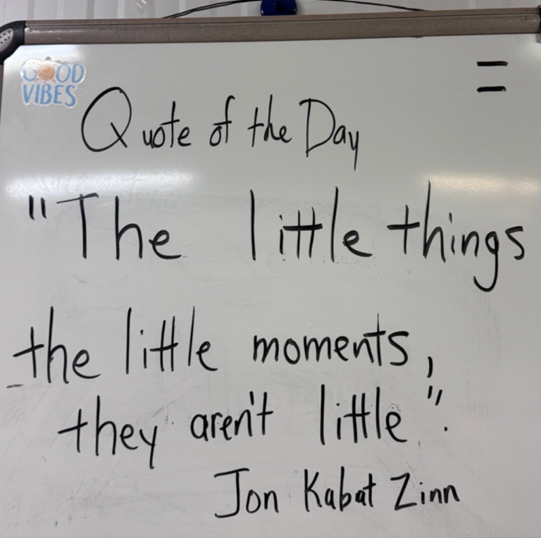 A quote is displayed in the Red Cross office at Camp Lemonnier on a white board that reads, "The little things, the little moments, they aren't little."