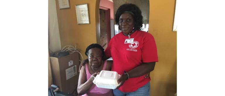 Bahamas Red Cross volunteer Maxine delivers lunch six days a week to Vernetta.