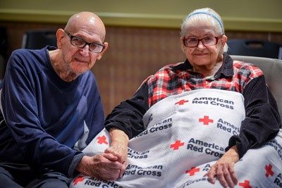 A couple stays in a Red Cross shelter after Hurricane Dorian
