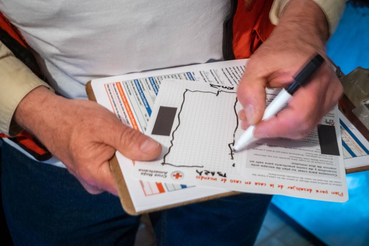 April 28, 2018. 
Binghamton, New York.
Smoke Alarm Installations, Sound the Alarm Campaign.
Pictured: Creating a Home Fire Escape Plan

An American Red Cross volunteer helps homeowners and renters create a Home Fire Escape Plan  as part of a national fire safety promotion called "Sound the Alarm." In an effort to reduce fatalities from home fires, teams of Red Cross volunteers go door-to-door across the country to install free smoke alarms, replace batteries in existing alarms, help families create escape plans and provide life-saving information about preventing and surviving home fires. 

Photo by Chuck Haupt for the American Red Cross.