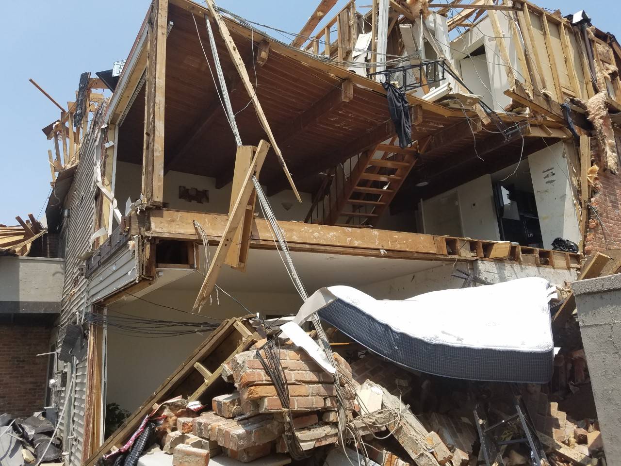 June 3, 2019. Rivers Edge, Harrison Township, Dayton Ohio. Bedroom and living area exposed by tornado damage in Harrison twp, Ohio. Photo by Gary Clark for the American Red Cross.