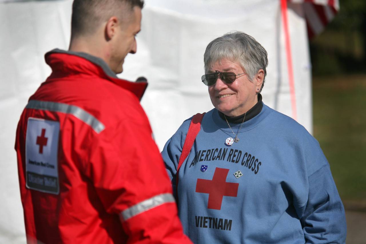An American Red Cross "Donut Dolly" who served the troops during the Vietnam War visits the Red Cross Service to the Armed Forces tent during Veterans Day weekend 2007.