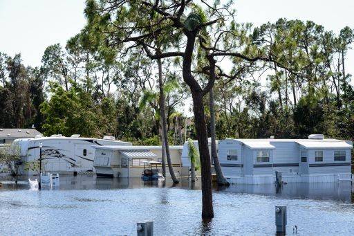 A destroyed home with flooding damage.