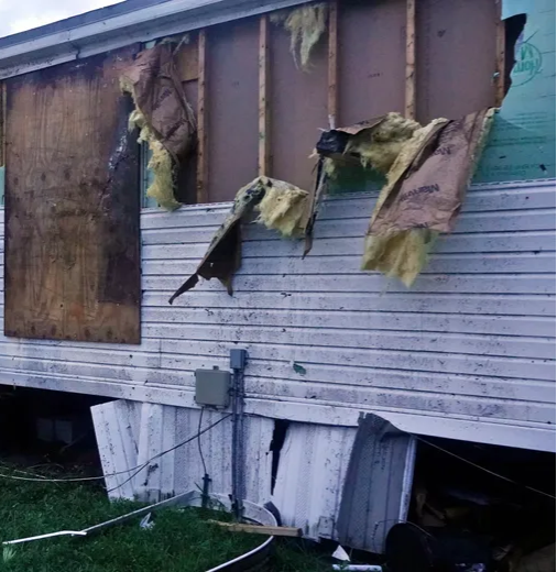 A mobile home with major damage from wind or tornado