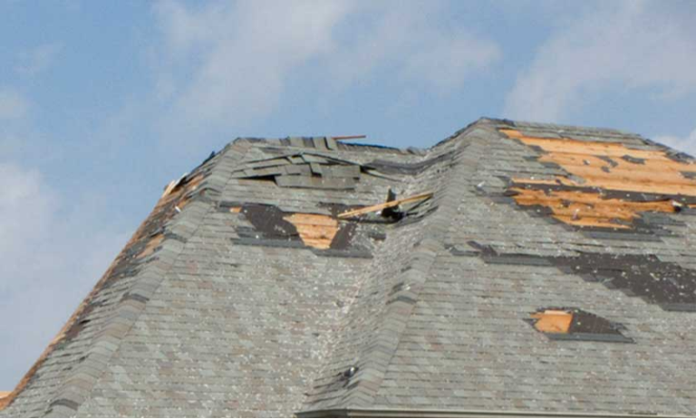 A home with moderate damage from wind