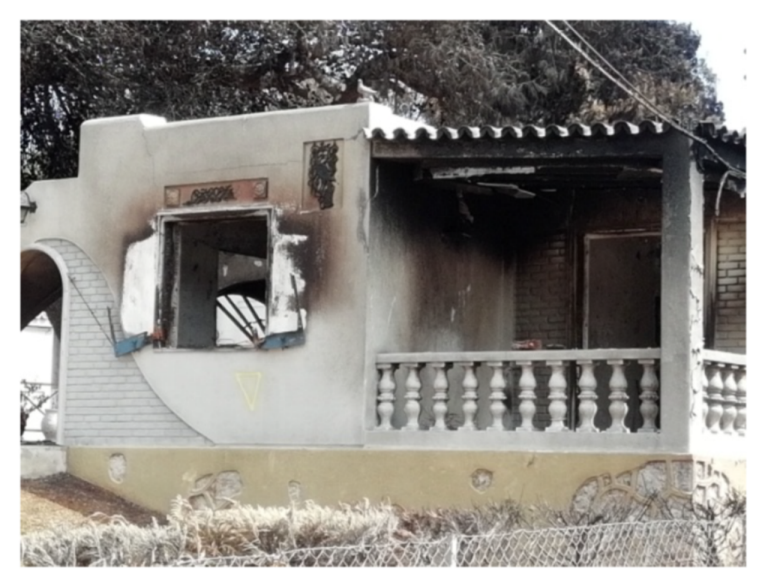 A home with minor wildfire damage