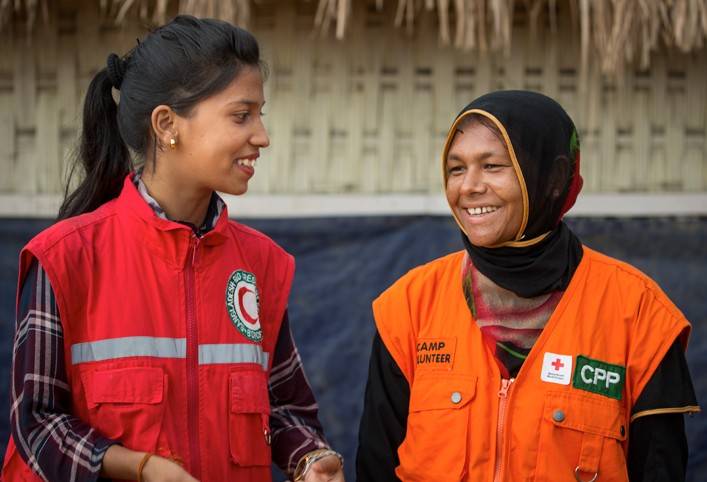 “I am working for my people. For my neighbors. For my family,” says Monoarca Begume (right)—a resident of Kutupalong camp. 