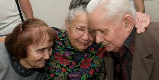 three elders embracing each other