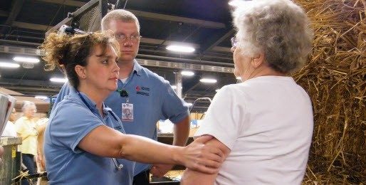 woman assisting elder woman