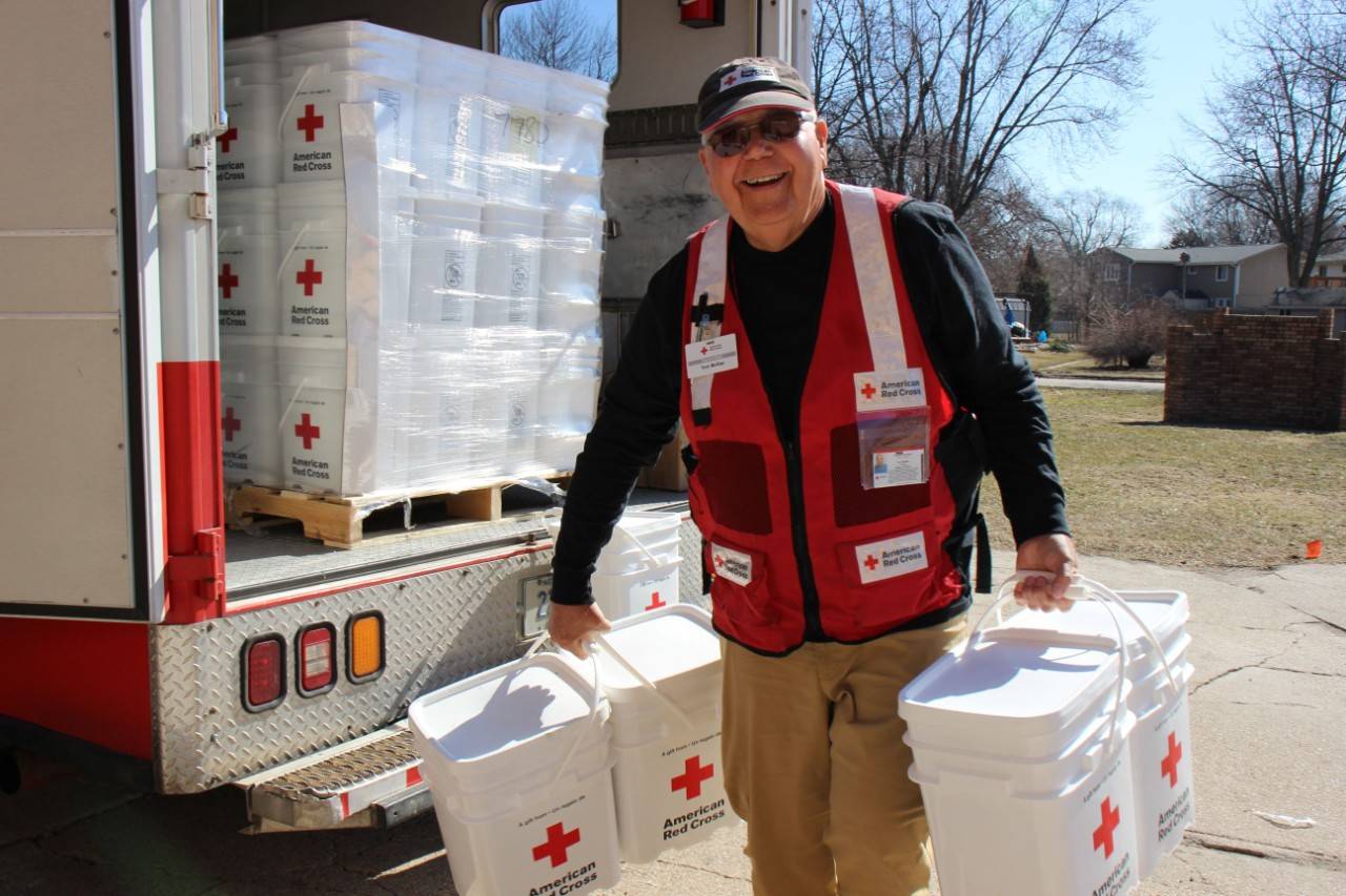 March 21, 2019. Christian Church of Waterloo, Waterloo, Nebraska. Outside the Christian Church of Waterloo, Tom McRae unloads cleanup kits for those affected by flooding. Photo by April Oppliger/American Red Cross