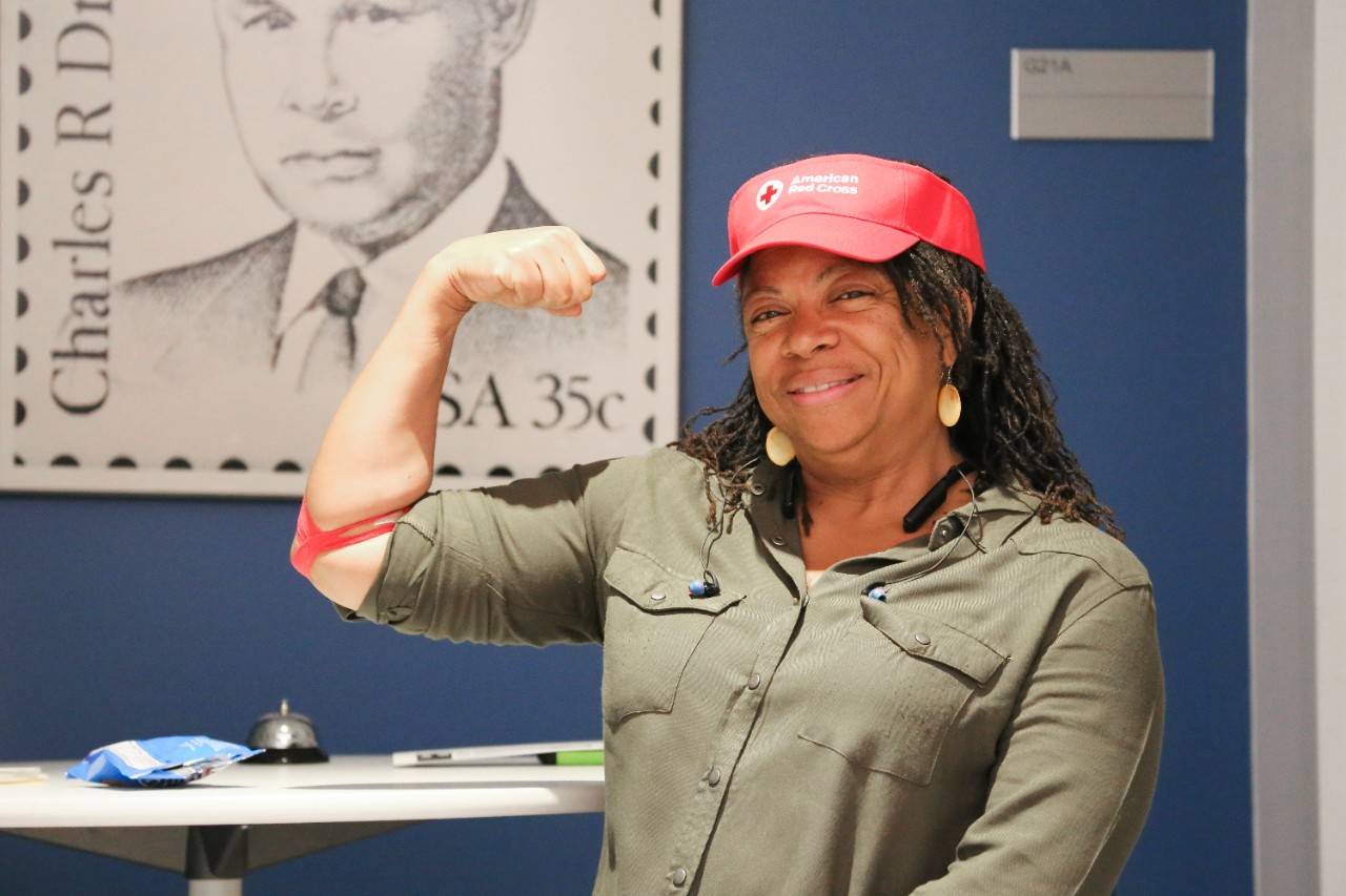 May 10, 2017. Washington, DC. Dawn Craig, an O+ donor for patients with sickle cell, enjoys some snacks in the refreshment area after donating whole blood. Photo by Amanda Romney/American Red Cross