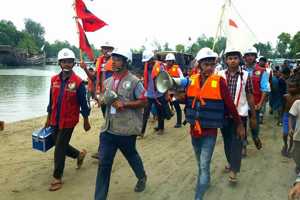 30 May 2017.Bangladesh Red Crescent Cyclone Preparedness Programme volunteers warn communities in coastal communities to evacuate to safety as Cyclone Mora makes landfall.