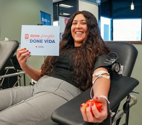 Woman donating blood to the Red Cross.