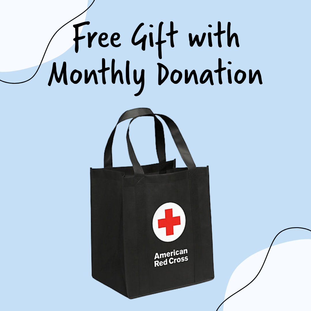 image of a black tote back with a red cross logo on the front with the text "free gift with monthly donation" above