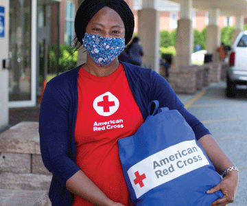 red cross nurse helps patient