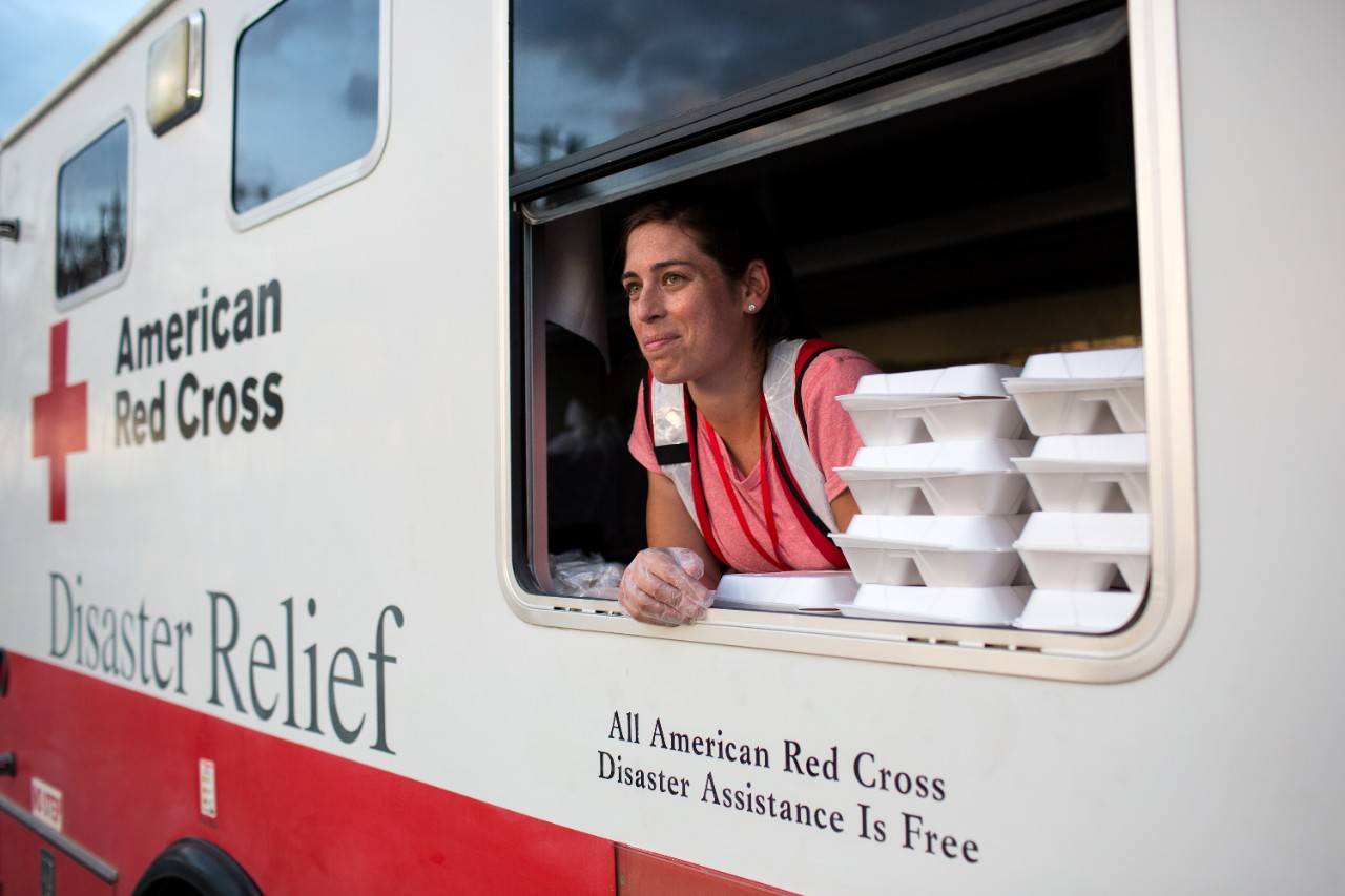 September 15, 2017. Marathon, Florida Keys, Florida.
Red Cross volunteer Kelly hands out hot meals for dinner in Marathon, Florida.
Photo by Marko Kokic for The American Red Cross