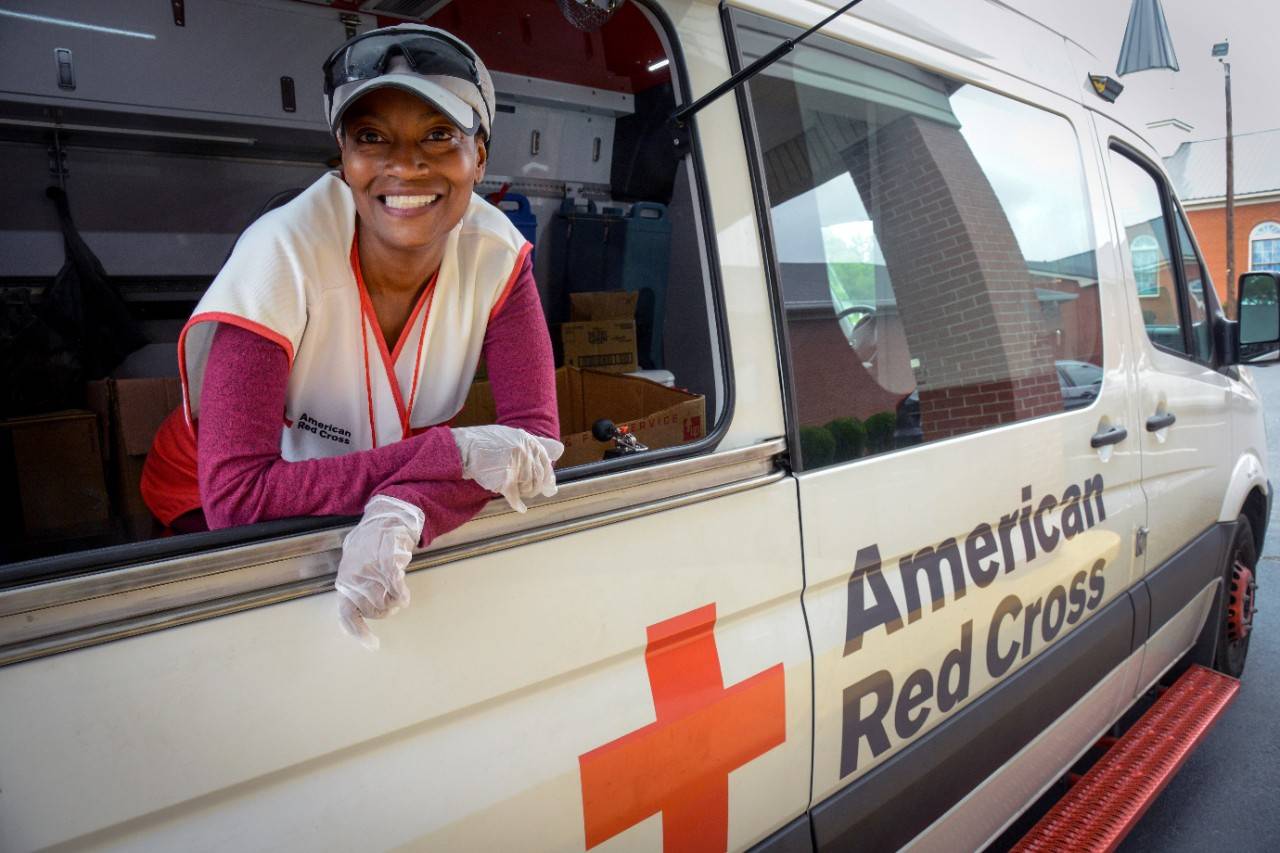 September 25, 2018. Cumberland Baptist Church, Hope Mills, North Carolina. Volunteer DeAndrea Fuller has a heartwarming story of selfless service. From St. Augustine, Florida with four children, she honorably served in the United States Navy for over 20 years. Proud of her role as Deputy Legal Advisor to the NATO Commander in Afghanistan, and a teacher of International Humanitarian Law, DeAndrea recently retired from the Navy in July. Now, she spends her time volunteering with the Red Cross and went on her first deployment to North Carolina just two weeks ago for Hurricane Florence. “I served my country so I could help people, now that I am retired, I serve for the American Red Cross.” She is currently getting trained in different specialties within the Red Cross so she can go on more deployments in the future.  Photo by Daniel Cima/American Red Cross