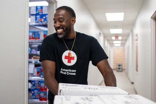 A Red Cross volunteer stocks supplies