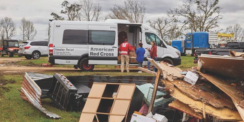 Volunteer helping with damages