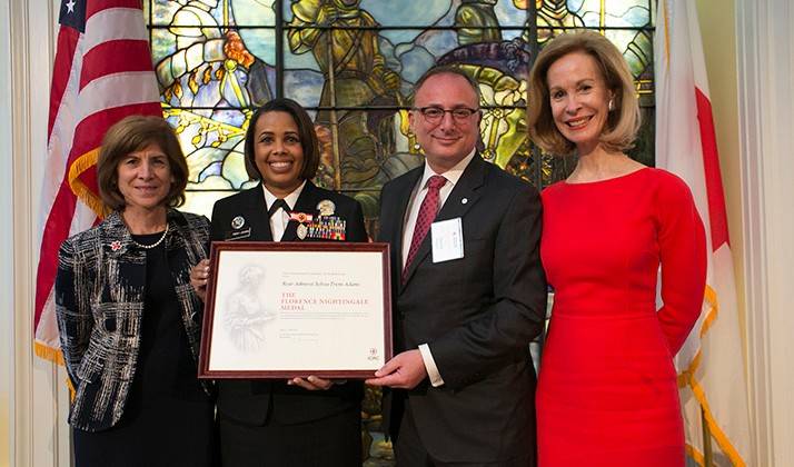 October 25, 2017. Washington, DC. Leadership Awards Reception and Dinner at the American Red Cross National Headquarters. This photo shows Rear Admiral Sylvia Trent-Adams receiving The Florence Nightingale Medal from Gail McGovern, David Meltzer and Bonnie McElveen-Hunter. Photo by Dennis Drenner for the American Red Cross