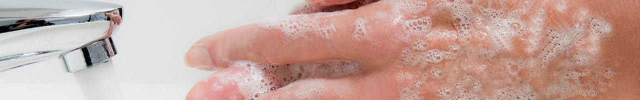 Close-up of person washing their hands