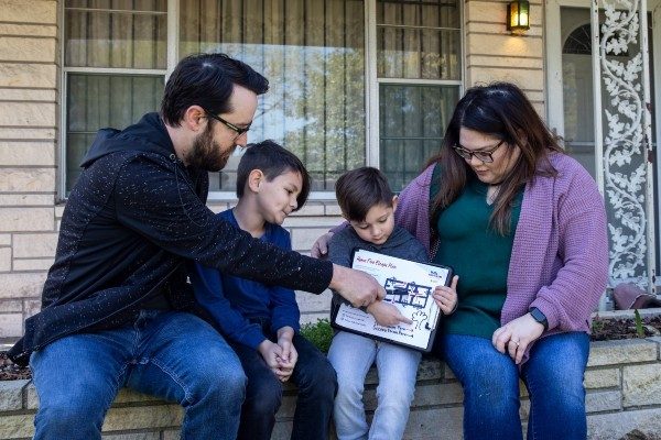 A family reviews their home fire escape plan