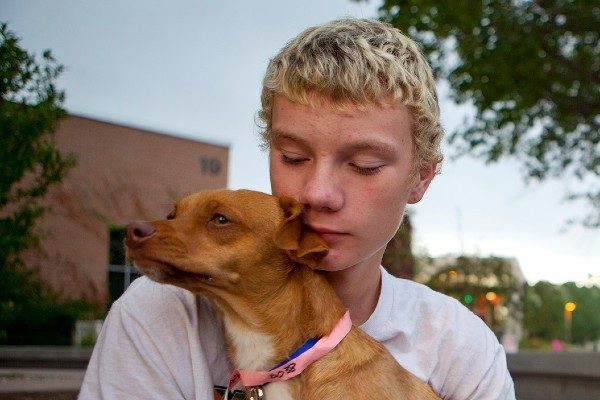 A boy holds his beloved dog