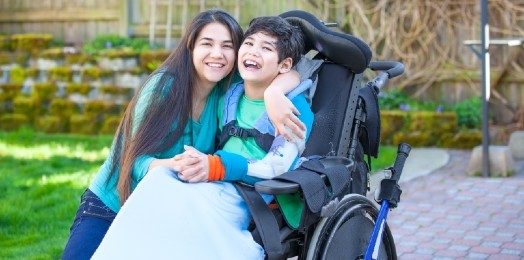 A family including a person who uses a wheelchair