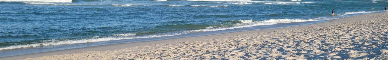 Ocean waves crashing on a sandy beach