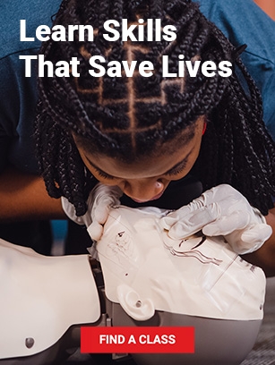 a person training in CPR on a dummy